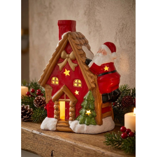 Ziemassvētku rotājumi MagicHome Christmas, Māja ar Ziemassvētku vecīti uz jumta, LED, terakota, 2xAAA, 27x13x34 cm